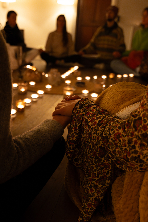 The team sits at a table with candles during a brainstorming session to boost creativity.